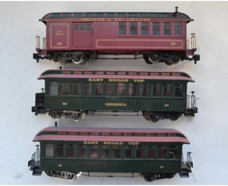 Three Bachmann G gauge passenger coaches with internal electrics. Good overall condition, some colour bleaching of roofs, see