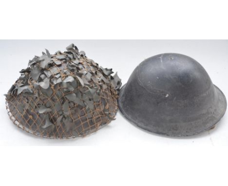 Two British Army MkIV Turtle helmets with liners, one dated 1955, the other no visible markings 