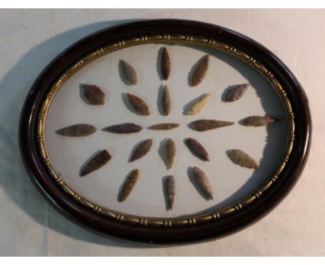Framed collection of 21 leaf shaped Neolithic period flint arrowheads 