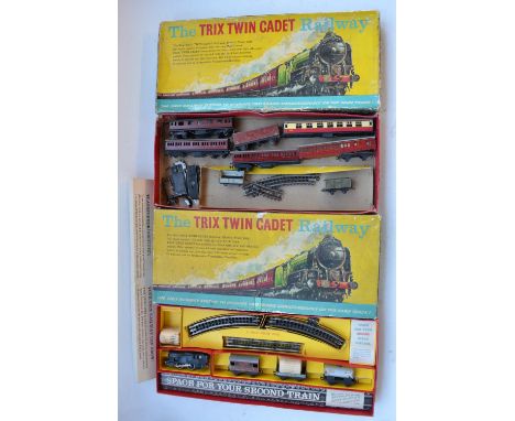 OO gauge 3 rail electric Trix Twin Cadet Railway set with 0-4-0 BR black tank engine, a collection of goods wagons and track,