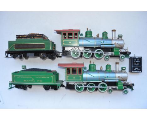 Two Bachmann G gauge radio controlled 4-6-0 battery powered locos and tenders with one transmitter unit. Please note one tend