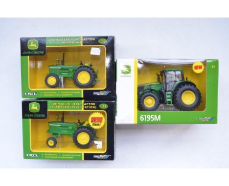 Boxed Britain's 1/32 John Deere tractor 6195M (item no 43150A1), Britain's/Ertl 4020 European Spec (item no 40923) and anothe