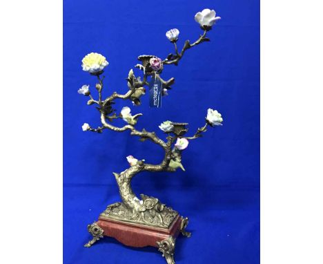 CAST METAL CANDLE HOLDER WITH CERAMIC BIRD DECORATIONwith a soapstone figure group