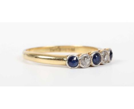 A gold, platinum, sapphire and diamond ring, collet set with three sapphires alternating with two old cut diamonds, detailed 