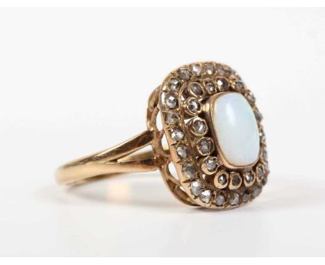 A gold, opal and diamond cluster ring, mounted with the cushion shaped opal within a rose cut diamond set two tier surround, 