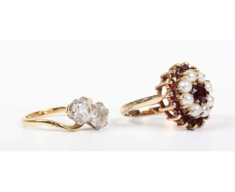 A gold and colourless gem set two stone ring in a crossover design, detailed ‘18ct’, weight 3.3g, ring size approx L, and a g