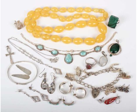A group of mostly silver jewellery, comprising a charm bracelet, two rings, two necklaces, four pendants, a bangle, six pairs