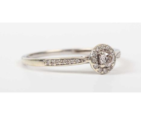 A 9ct white gold and diamond cluster ring, claw set with the principal circular cut diamond at the centre, weight 1.6g, ring 