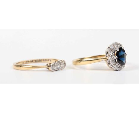 A gold, sapphire and diamond oval cluster ring, claw set with an oval cut sapphire within a surround of circular cut diamonds