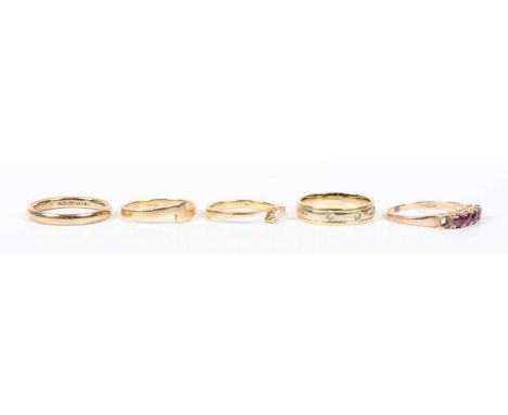 An 18ct two colour gold and diamond ring, mounted with three circular cut diamonds, ring size approx J, an 18ct gold ring in 