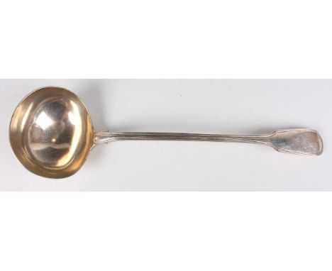 A William IV silver Fiddle and Thread pattern soup ladle, crest engraved, London 1834 by William Eaton, weight 295.4g, length