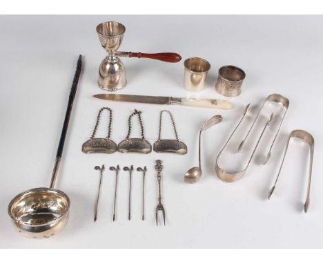 A group of silver, including a twin spirit measure with turned wood handle, Birmingham 1962, a pair of decanter labels, engra