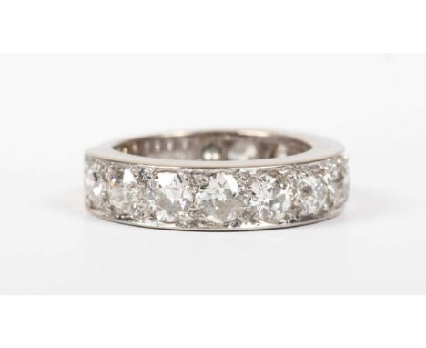 An 18ct white gold and diamond half eternity ring, mounted with a row of eleven old cut diamonds, London 1978, fitted with si