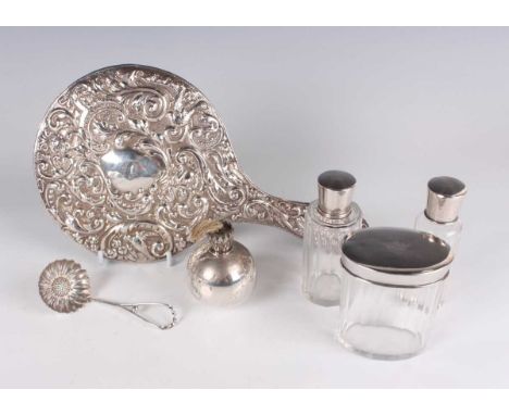 Three French silver mounted cut glass dressing table bottles and covers, weight of covers 48.4g, a silver mounted hand mirror