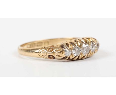 A late Victorian 18ct gold and diamond five stone ring, mounted with a row of graduated old cut diamonds, Birmingham 1897, we