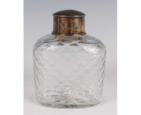 A George III silver mounted cut glass tea caddy, circa 1770, the flattened oval body with overall diamond faceted flat cut an