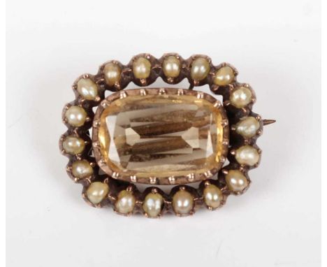 A Georgian gold brooch, mounted with a rectangular cushion shaped pale orange topaz within a surround of seed pearls, unmarke