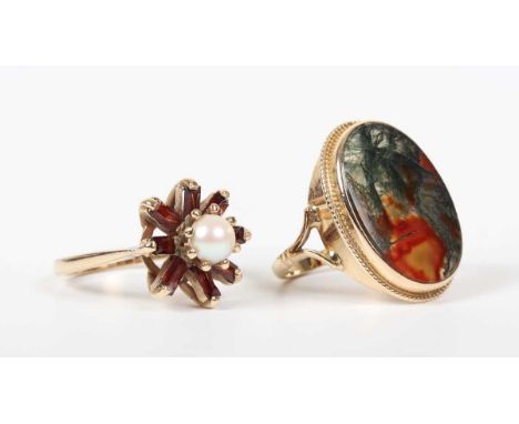 A 9ct gold ring, collet set with an oval moss agate within a ropetwist border, marks rubbed, ring size approx J, and a 9ct go