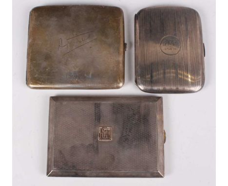 A George V silver engine turned rectangular card case, the gilt interior with engraved and pierced grille, London 1913 by Geo