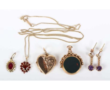 A 9ct gold mounted bloodstone and cornelian rotating pendant fob, length 2.7cm, a 9ct gold heart shaped pendant locket, a pai