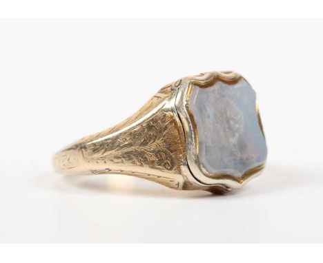 A Victorian gold and agate intaglio ring, the shield shaped intaglio carved with a portrait below motto 'Duris Non Frangor' (