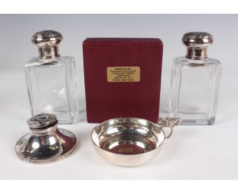 An Elizabeth II silver tasse du vin, the circular bowl flanked by a naturalistic ring handle surmounted by vine leaves and gr