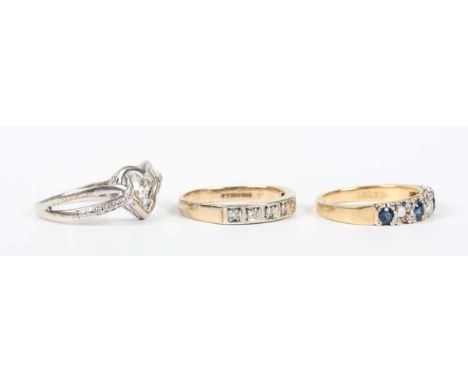 A 9ct gold and diamond seven stone half hoop ring, Birmingham 1995, weight 1.9g, ring size approx J1/2, a gold, sapphire and 