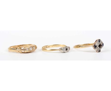 A gold and diamond ring, mounted with four diamonds, detailed ‘18ct’, weight 2g, ring size approx K1/2 (one diamond lacking),
