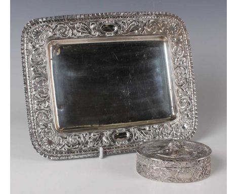 A Spanish .916 silver rectangular dressing table tray, the wide rim embossed with foliate scrolls, by Matilde Espunes, weight