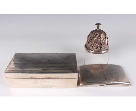 An Edwardian silver mounted desk bell of domed form with push finial above pierced and embossed spiral and foliate decoration