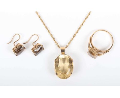 A gold pendant, claw set with an oval cut citrine, unmarked, length 2.8cm, with a gold multiple link neckchain on a boltring 