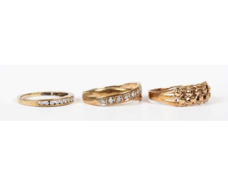 A 9ct gold ring in a beaded and interwoven keeper design, indistinct marks, ring size approx P1/2, a 9ct gold and diamond nin