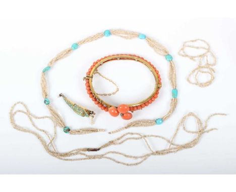 A multiple strand seed pearl necklace on a gold, turquoise and diamond clasp, designed as a snake’s head with diamond set eye