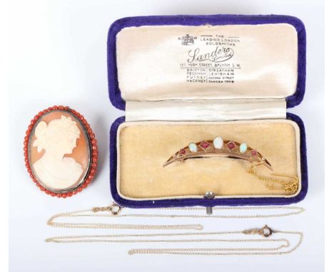 A gold, opal and garnet topped doublet brooch, designed as a crescent, detailed ‘9ct 375’, weight 3.7g, width 5cm, with a cas