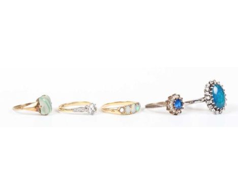 A gold ring, mounted with four oval opals, unmarked, weight 3.2g, ring size approx N1/2 (one opal lacking), a gold and colour