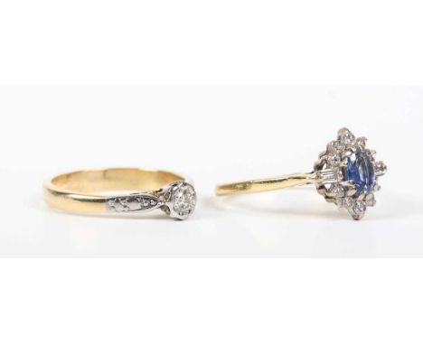 An 18ct gold, sapphire and diamond cluster ring with baguette cut diamond set shoulders, London 1988, weight 2.6g, ring size 