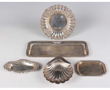 A late Victorian silver buttershell, raised on ball feet, Sheffield 1898 by Atkin Brothers, length 12cm, a silver rectangular