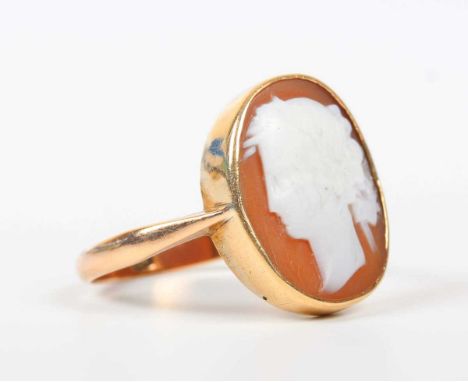 A gold and oval shell cameo ring, carved as a portrait of a classical lady, detailed ‘9ct’, weight 3.6g, ring size approx T.