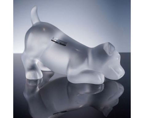 Sculpted in frosted crystal, this Lalique figurine captures a playful puppy in a crouching pose, suggesting eager movement or