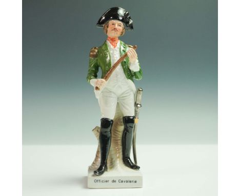 Hand painted porcelain figurine depicting a French cavalry officer. The figure is shown in military uniform featuring a green