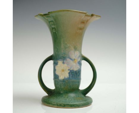Roseville Pottery vase in the Magnolia pattern, showcasing a flared trumpet form with softly scalloped rim and rounded loop h
