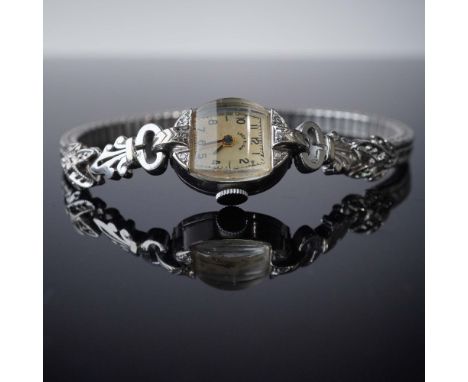 Vintage Lady Elgin wristwatch featuring a rectangular face with Arabic numerals and the Lady Elgin logo on the dial. The case