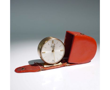 A mid-century mechanical travel alarm clock by Swiza, a renowned Swiss horological brand. The clock features a clean silver-t