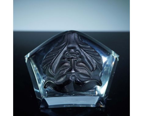 Lalique crystal paperweight titled Masque de Femme, featuring a stylized black satin-finished satyr mask surrounded by flowin