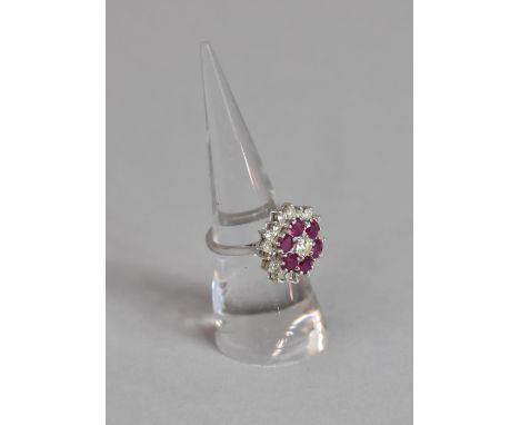 A Good 18ct Gold Diamond and Ruby Floral Cluster Ring, Centre Brilliant Cut Diamond (Approx .3ct) with Border with Six Larger