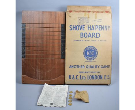A Late 20th Century Shove Halfpenny Board by K C ltd, with Disks, 60cm long and Complete with Original Cardboard Box 