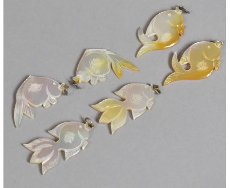 A Collection of Various Carved Mother of Pearl Pendants in the Form of Fish 