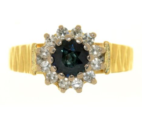 A SAPPHIRE AND DIAMOND RING, TEXTURED 18CT GOLD HOOP, BIRMINGHAM 1971, 5.5G, SIZE M++LIGHT WEAR CONSISTENT WITH AGE 