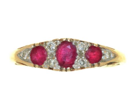 A RUBY AND DIAMOND RING IN 9CT GOLD, CONVENTION MARKED, INSCRIBED '0.10CT', 3G, SIZE S½++LIGHT WEAR CONSISTENT WITH AGE