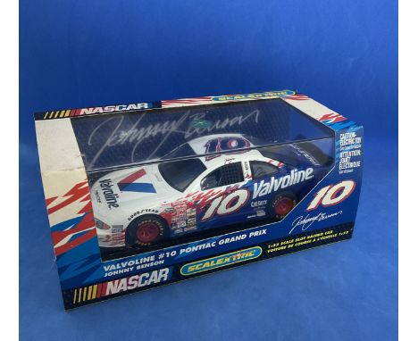 Scalextric Nascar Valvoline no.10 Pontiac Grand Prix 1.32 scale white racing car with driver in display case. Measures 6 inch